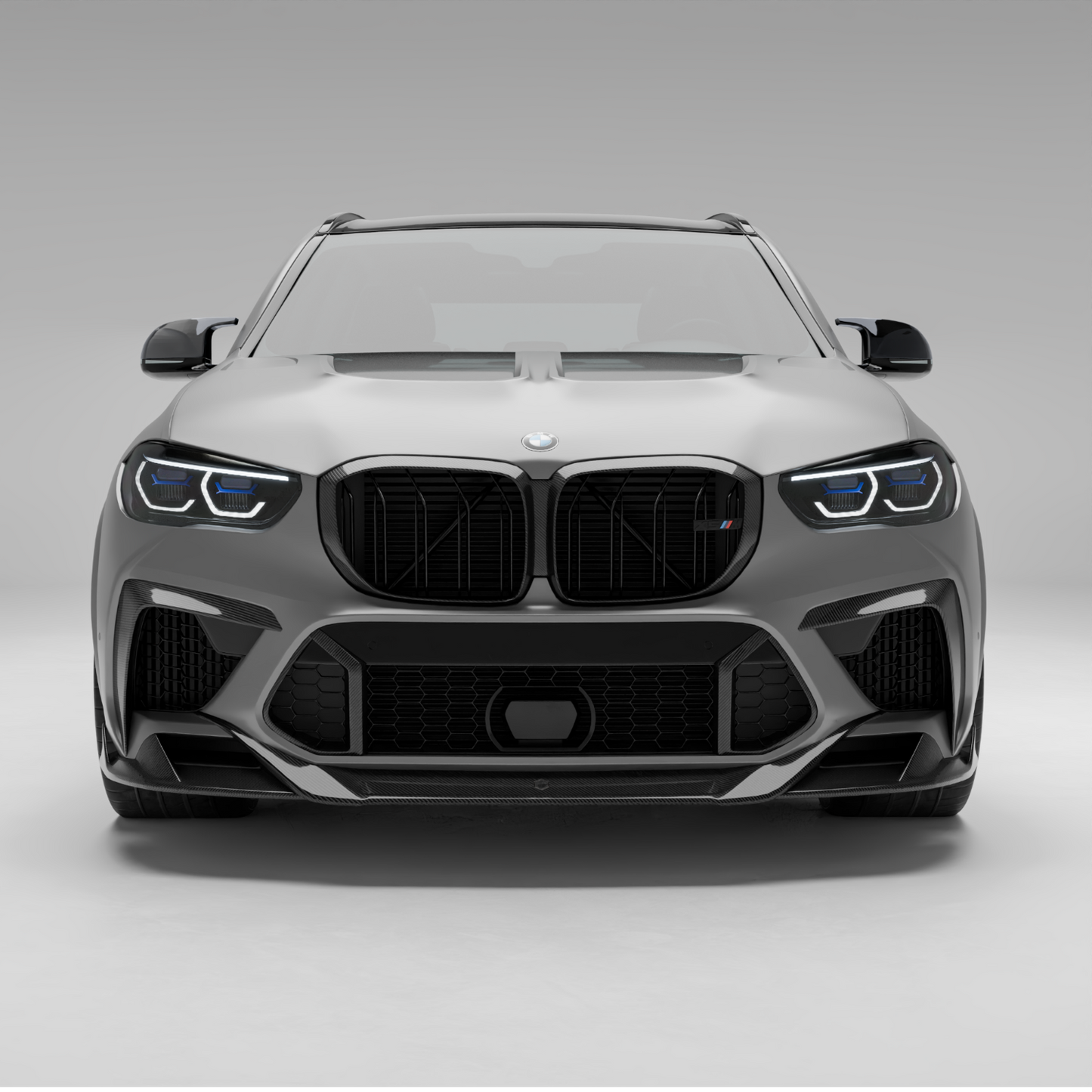 X5M F95 carbon front lip surface texture close-up