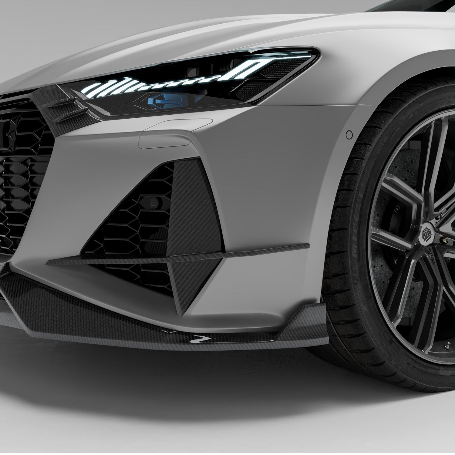 Audi RS7 C8 carbon fiber canards front three-quarter view on bumper