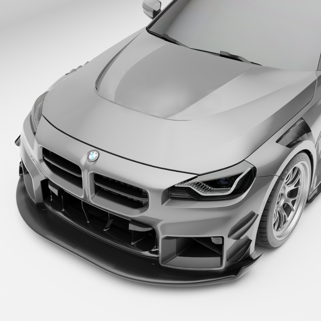 BMW M2 G87 carbon fiber vented hood, front three-quarter studio view