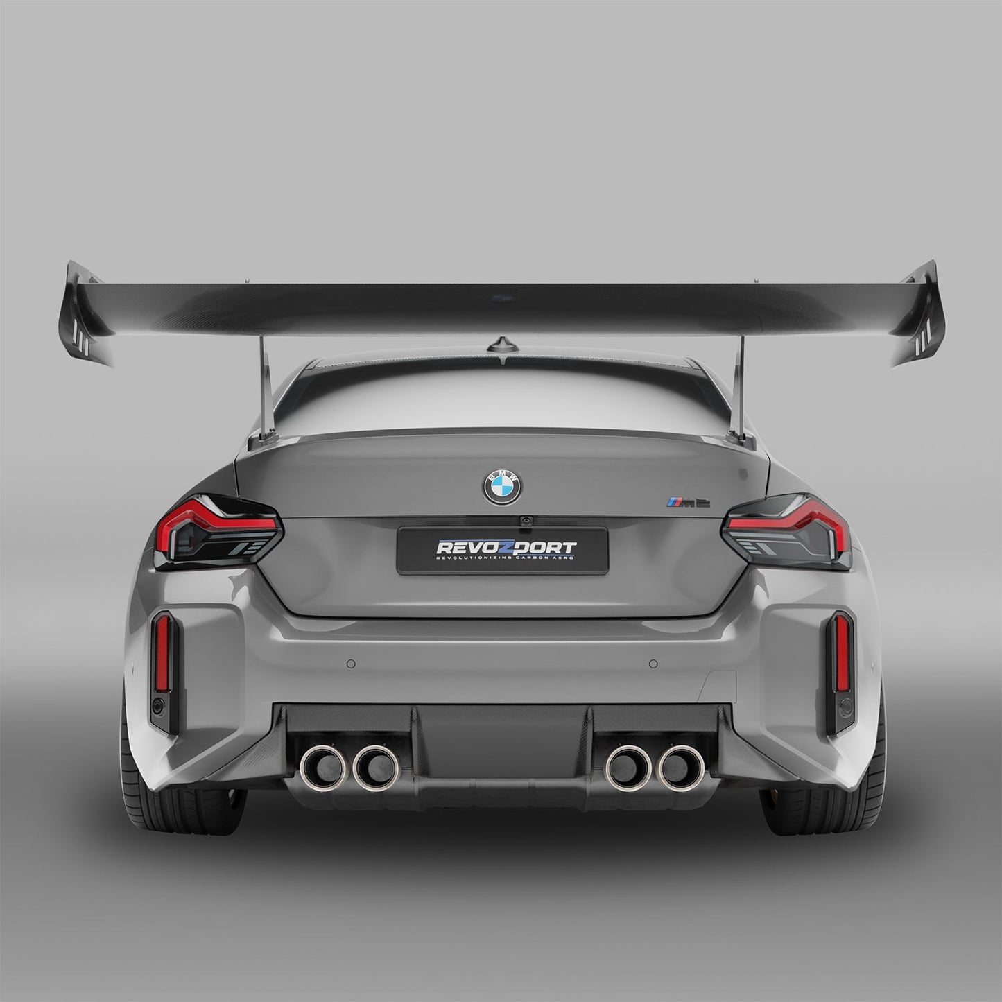 BMW M2 G87 carbon fiber rear wing mounted, top-down view