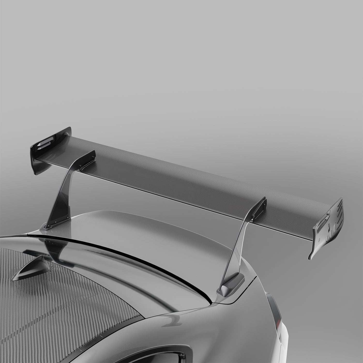 BMW M2 G87 carbon fiber rear wing installed, angled rear shot