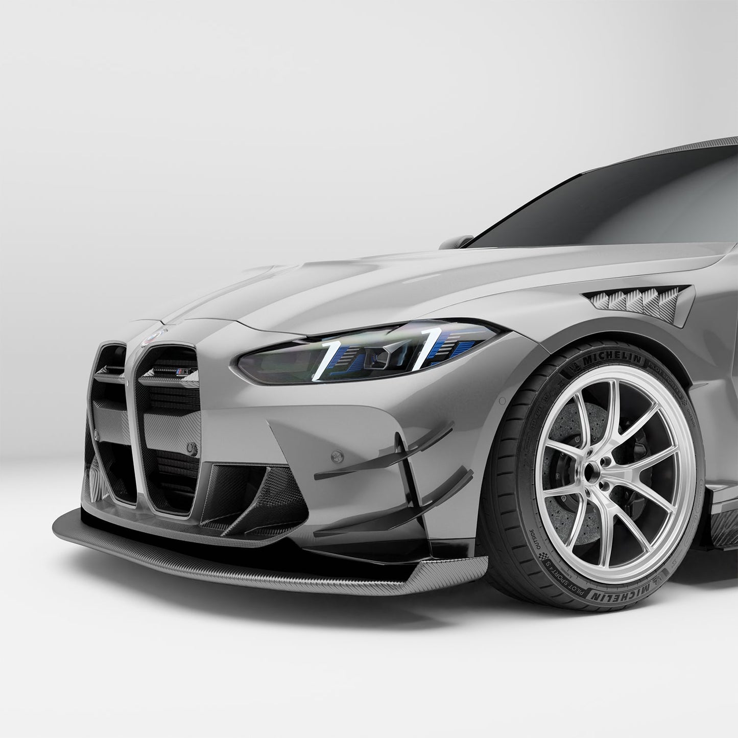 BMW M3 G80 carbon fiber splitter mounted low angle view
