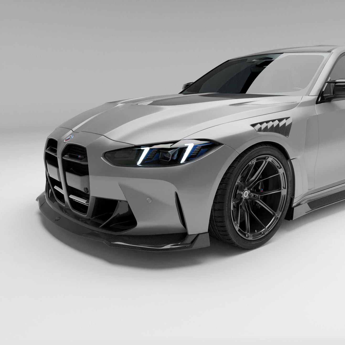 BMW M3 G80 sedan front end with carbon lip and grille