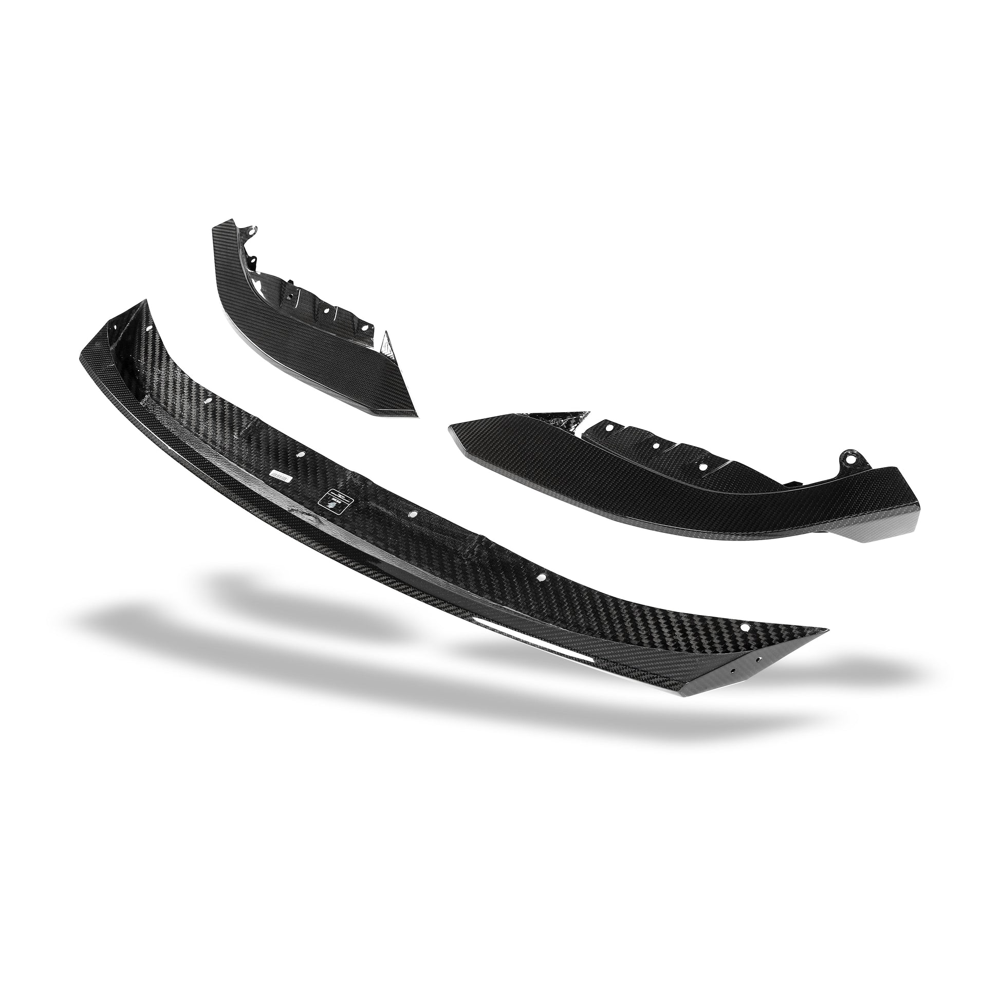BMW M3 G81 carbon fiber front lip close-up of weave