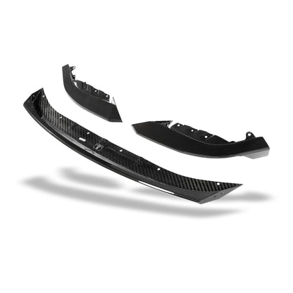 BMW M3 G81 carbon fiber front lip close-up of weave