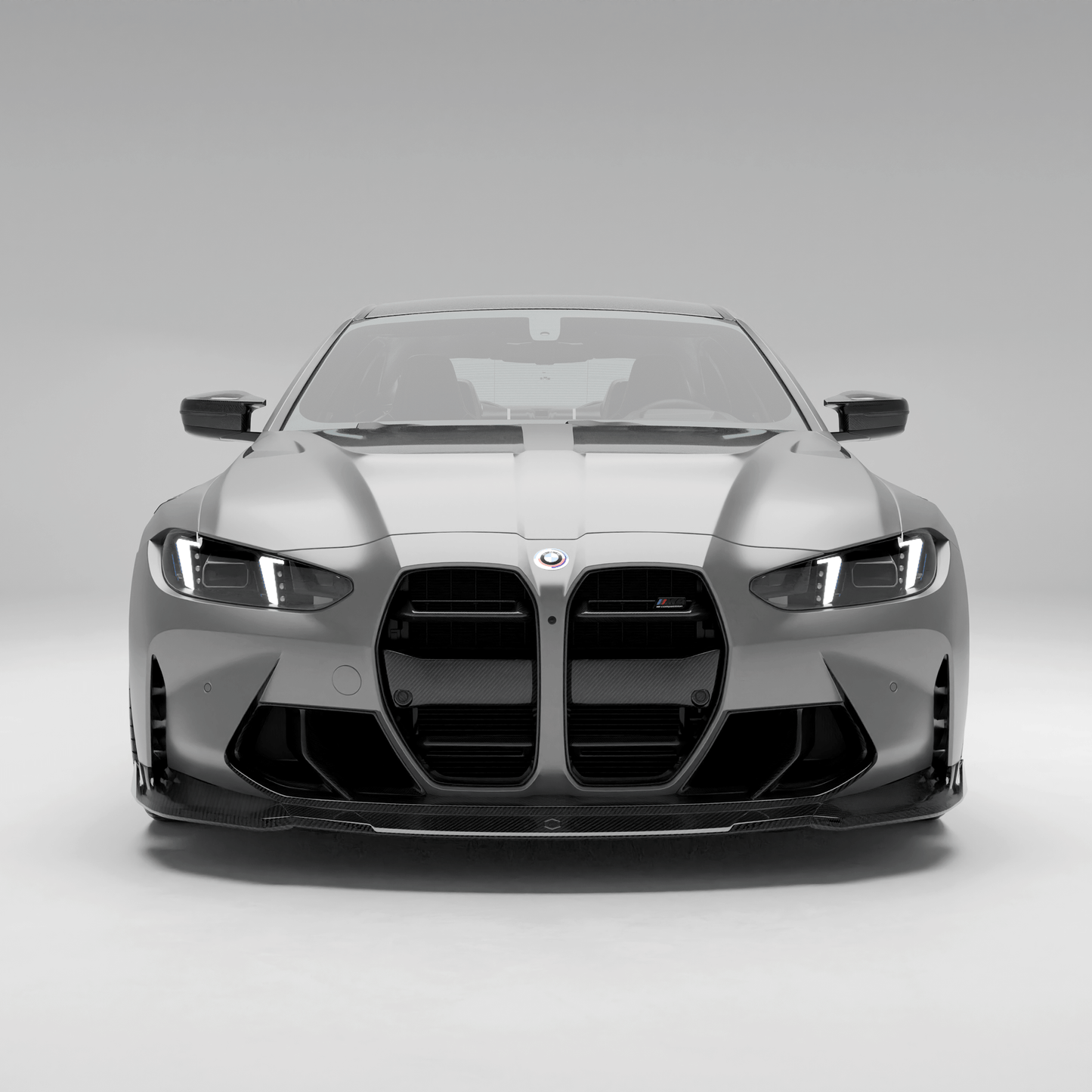 BMW M4 G82 carbon fiber front trim, front-facing studio view
