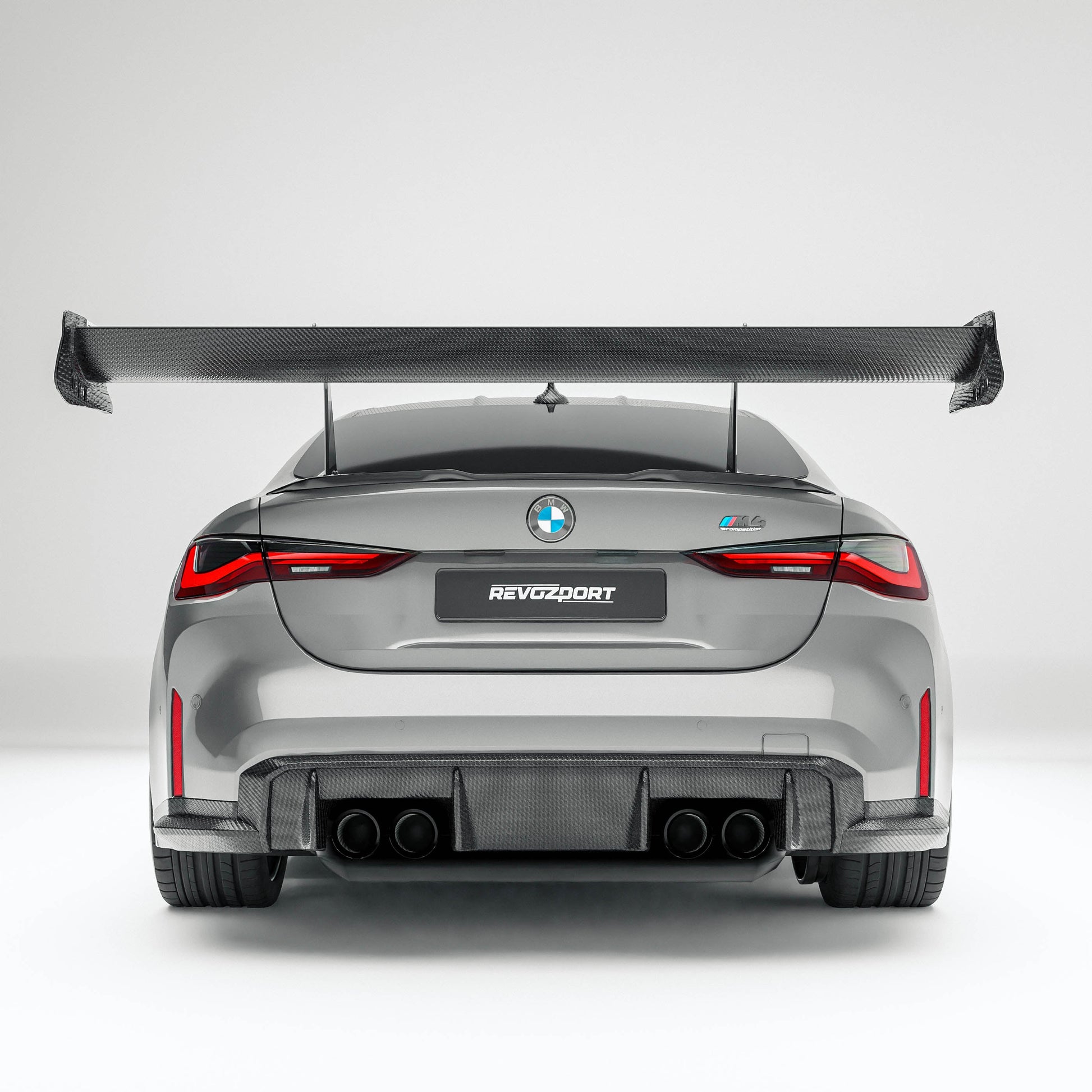BMW M4 G82 carbon fiber rear wing rear three-quarter view on the car