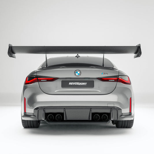 BMW M4 G82 carbon fiber rear wing rear three-quarter view on the car