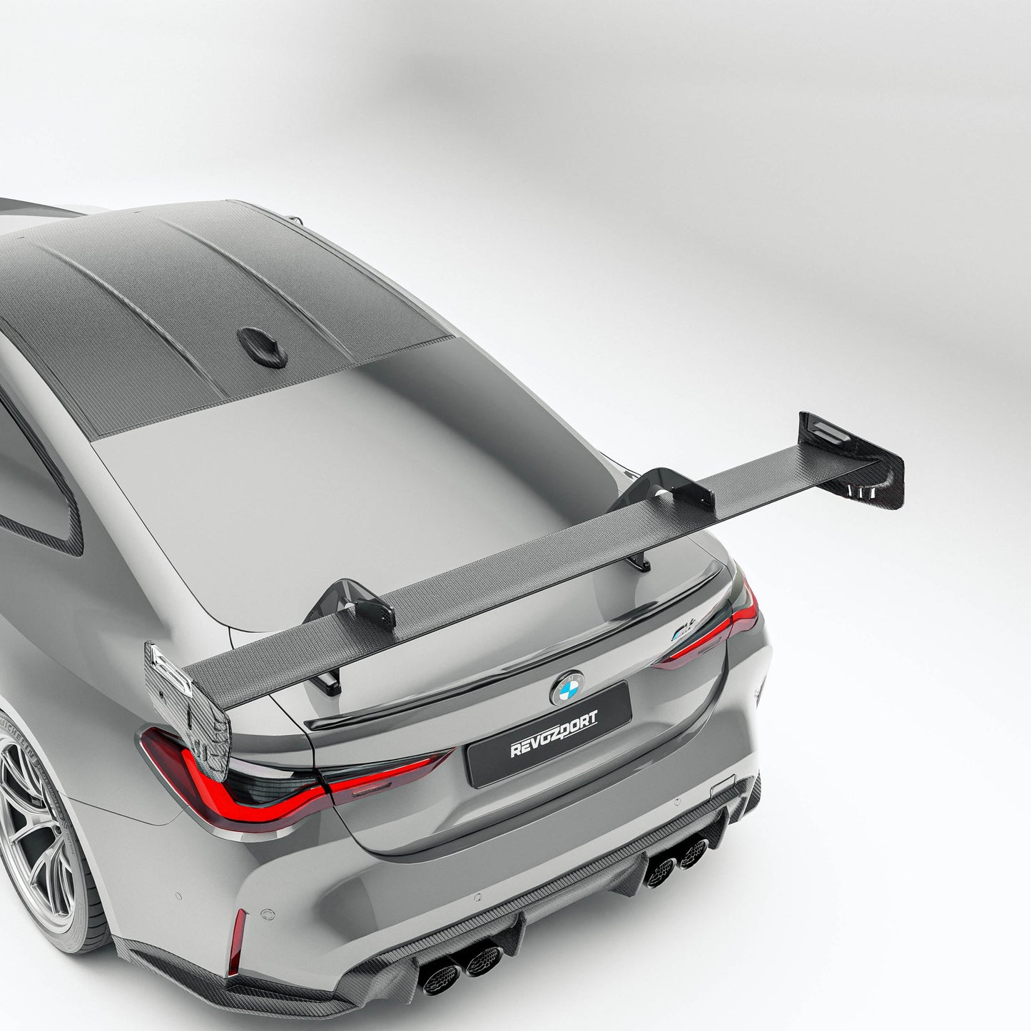 BMW M4 G82 carbon fiber rear wing mounted low angle view