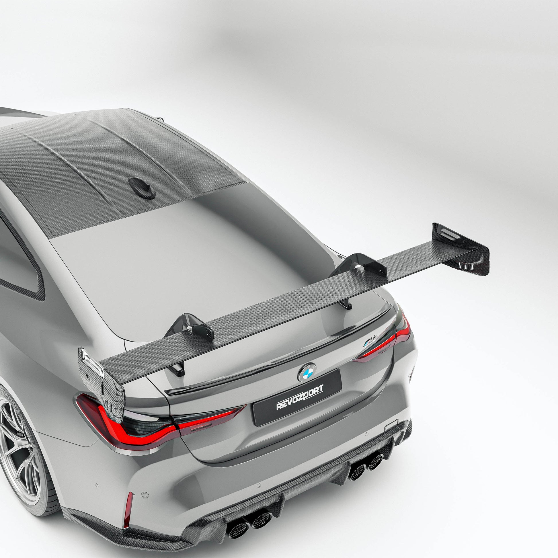 BMW M4 G82 carbon fiber rear wing mounted low angle view
