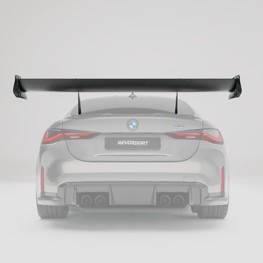 BMW M4 G82 carbon fiber rear wing side profile showing airfoil shape