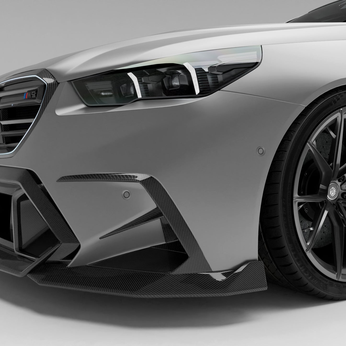 BMW M5 G90 carbon fiber front canards mounted corner view