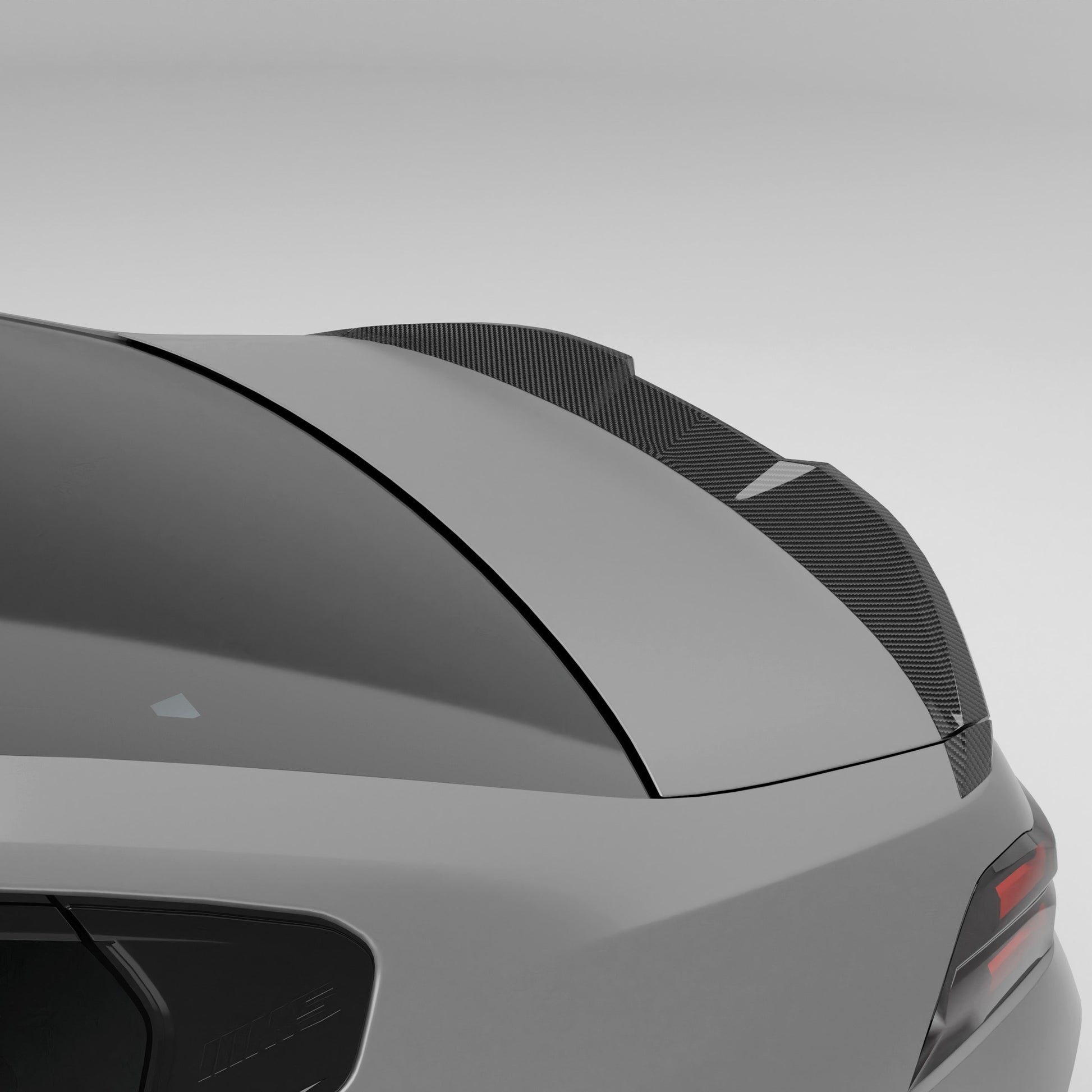 BMW M5 G90 carbon fiber trunk spoiler rear three-quarter view