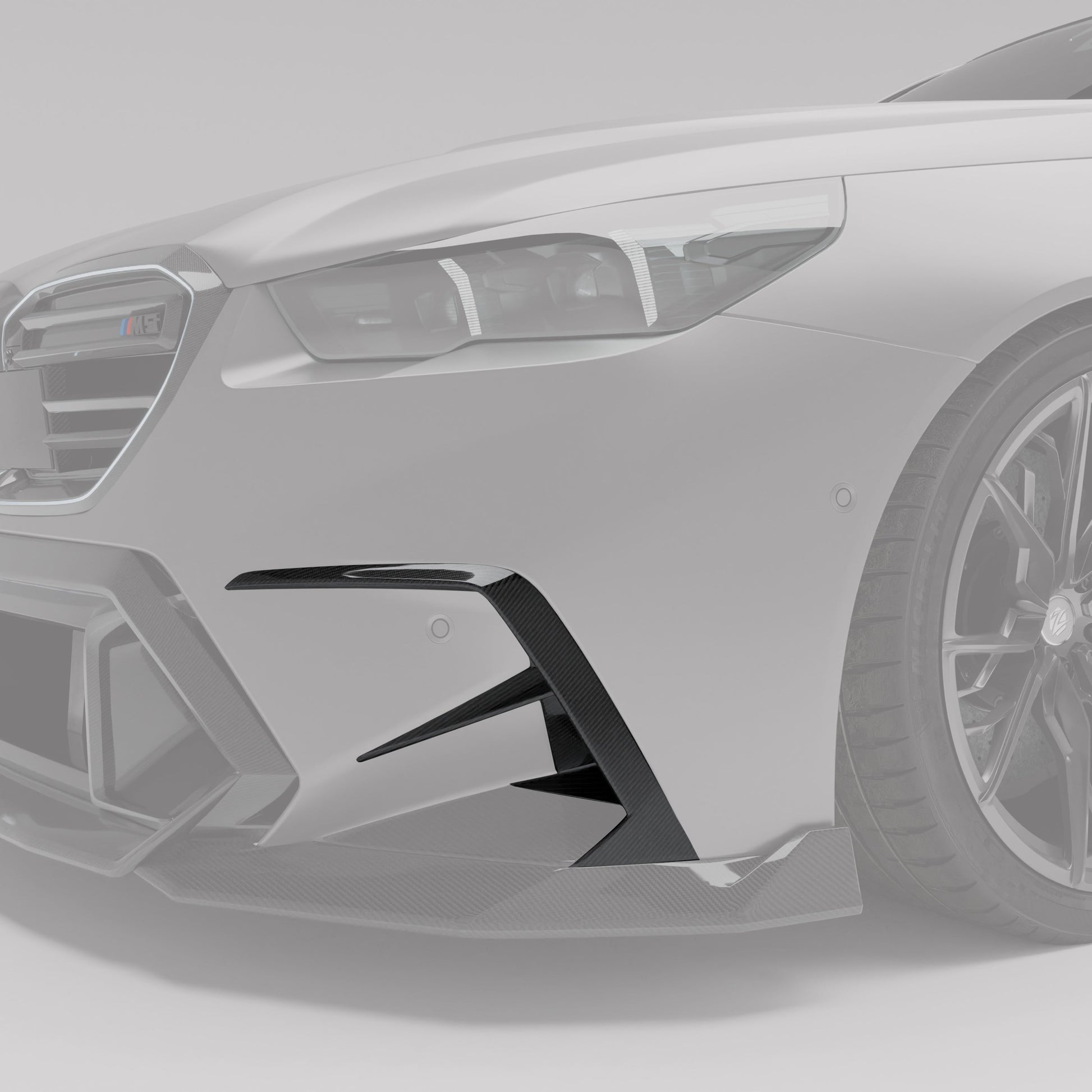 Carbon fiber front canards installed on BMW M5 G99 bumper