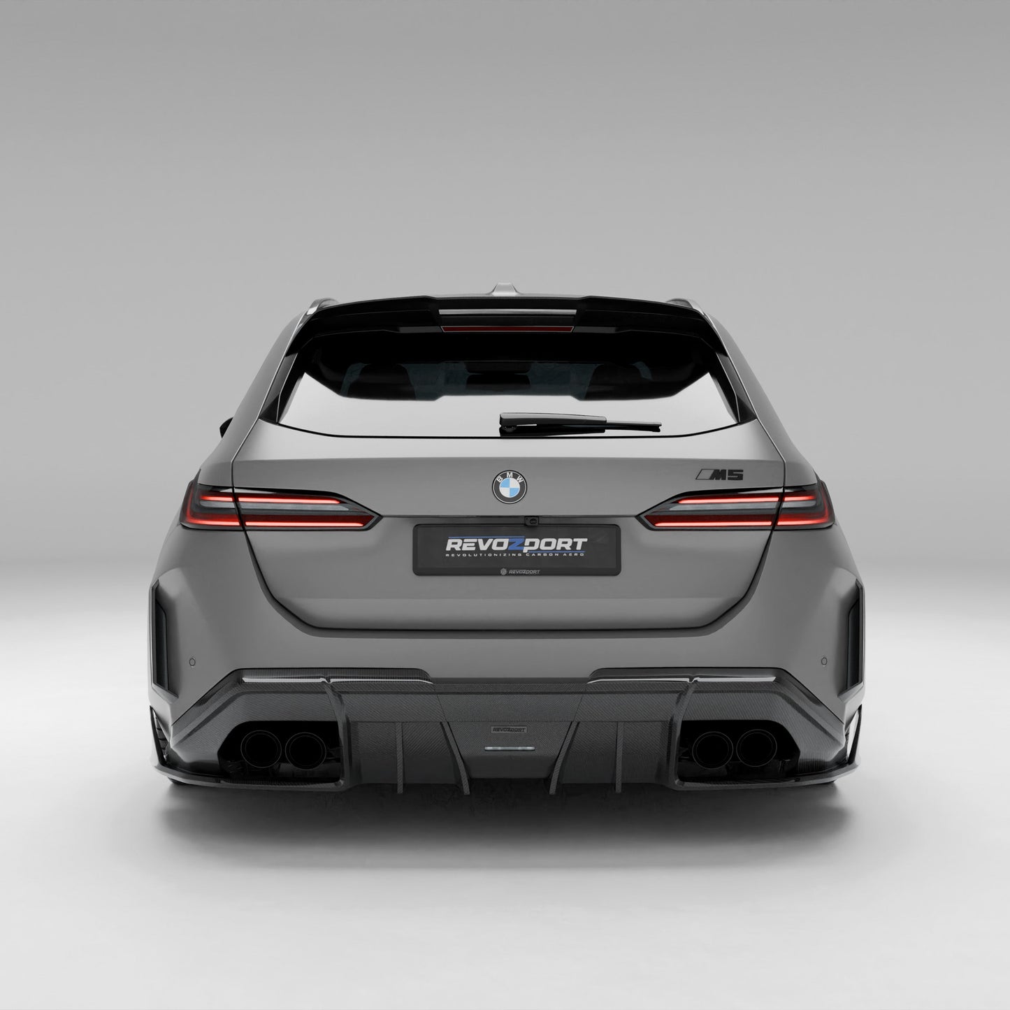 BMW M5 G99 carbon rear diffuser installed lower rear angle