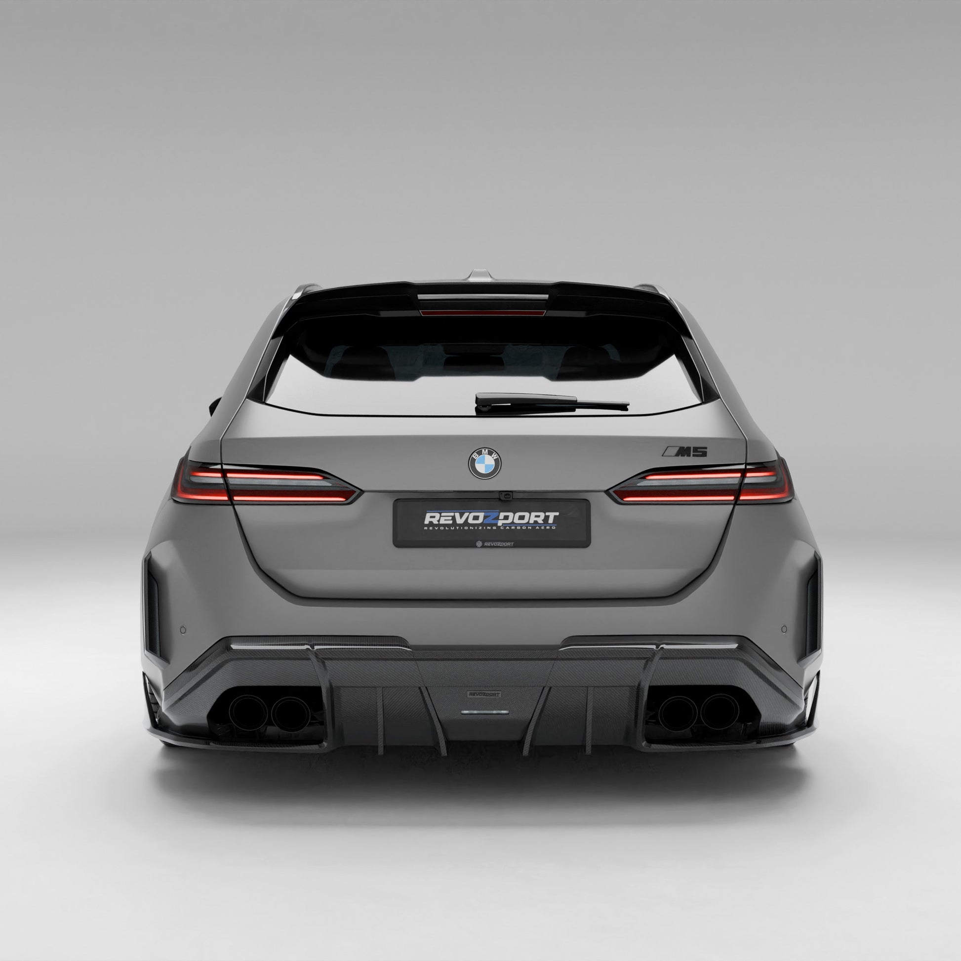 BMW M5 G99 carbon rear diffuser installed lower rear angle