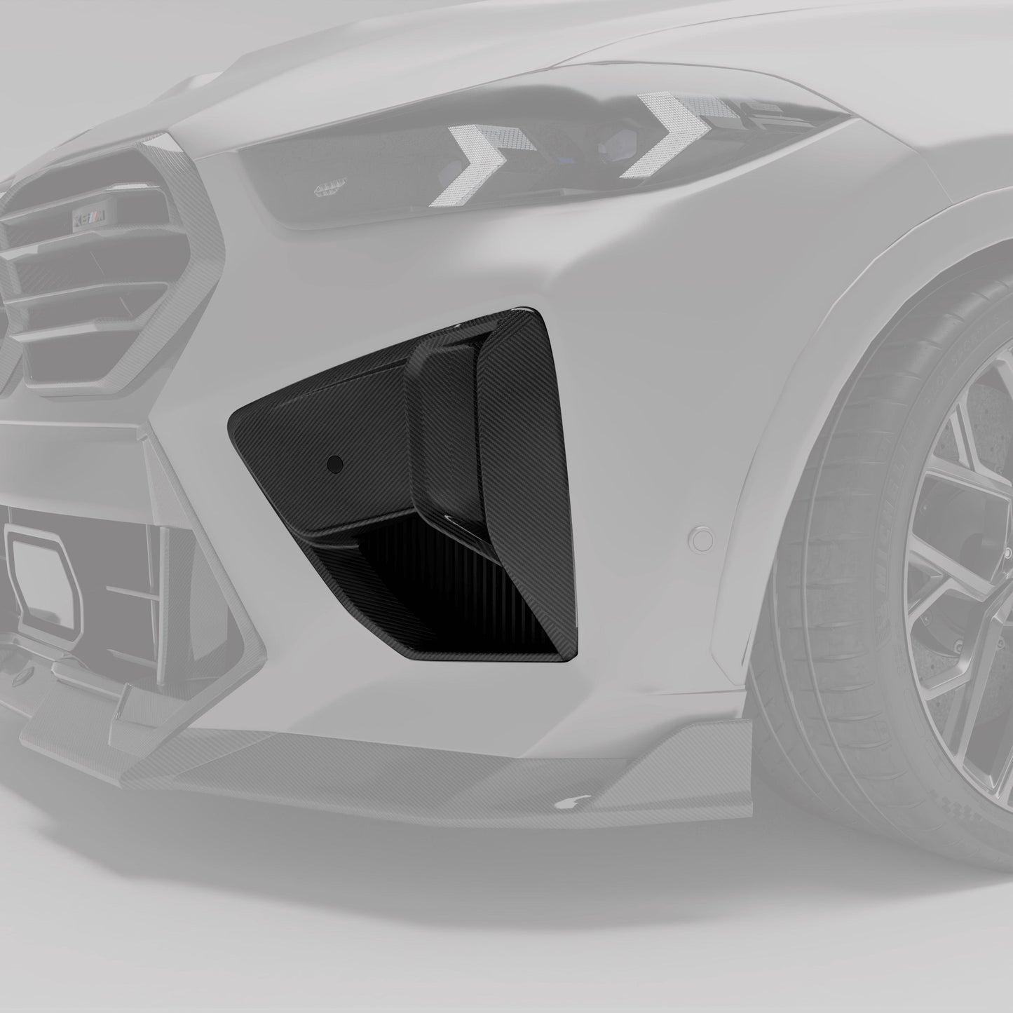 BMW X6M F96 LCI carbon fiber air vent angled close-up