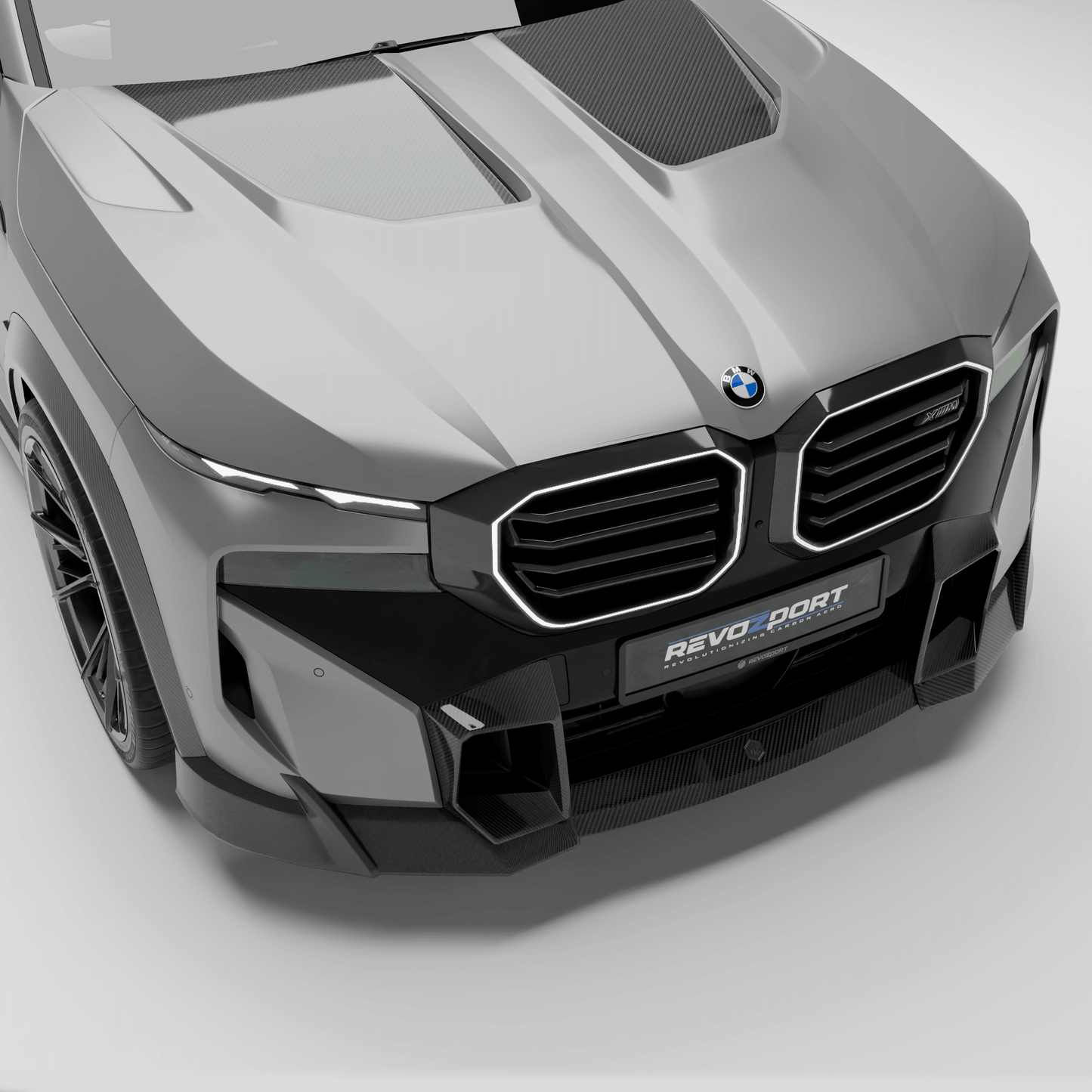 BMW XM G09 carbon fiber hood shown in full top-down studio view