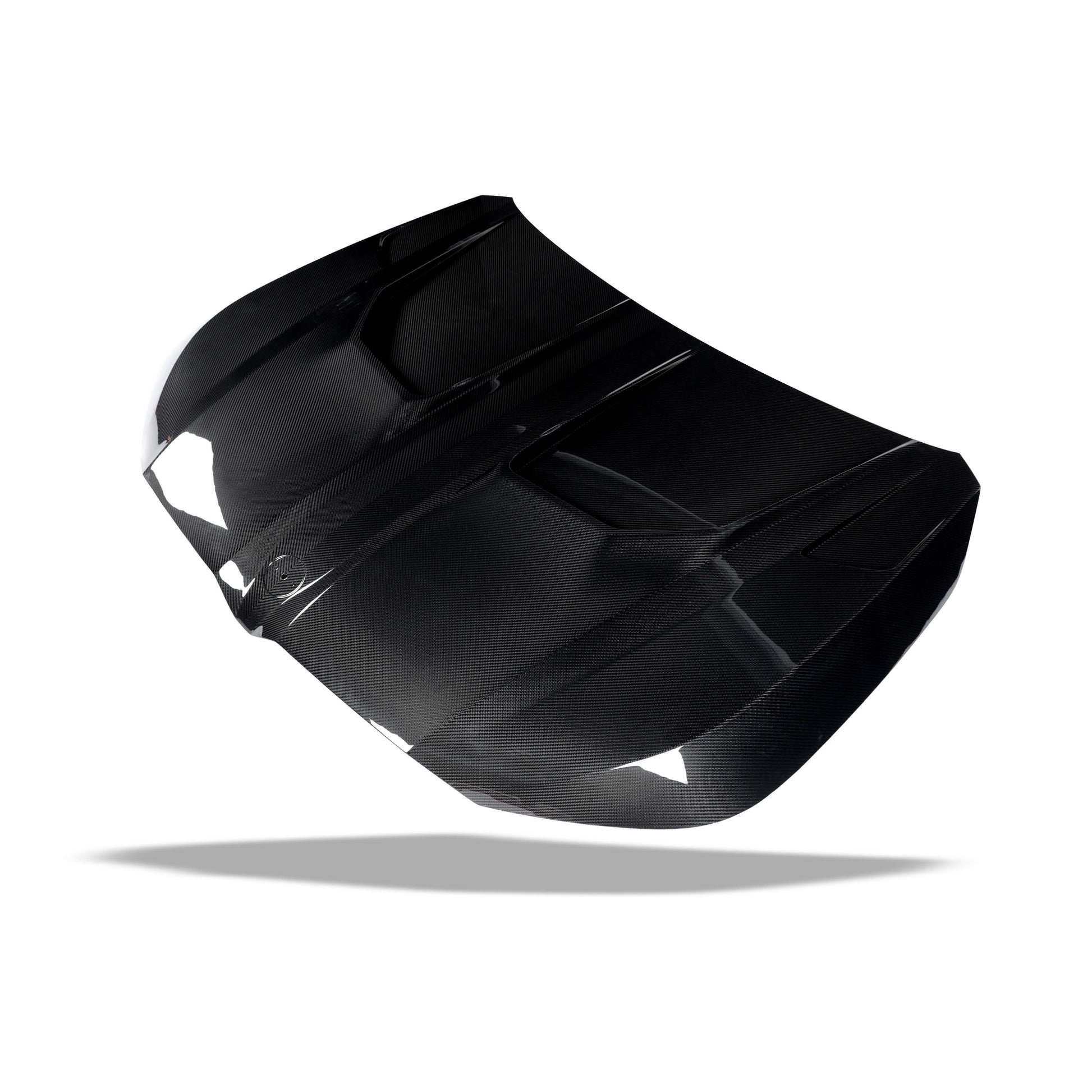 BMW XM G09 carbon fiber hood angled view emphasizing front-end presence