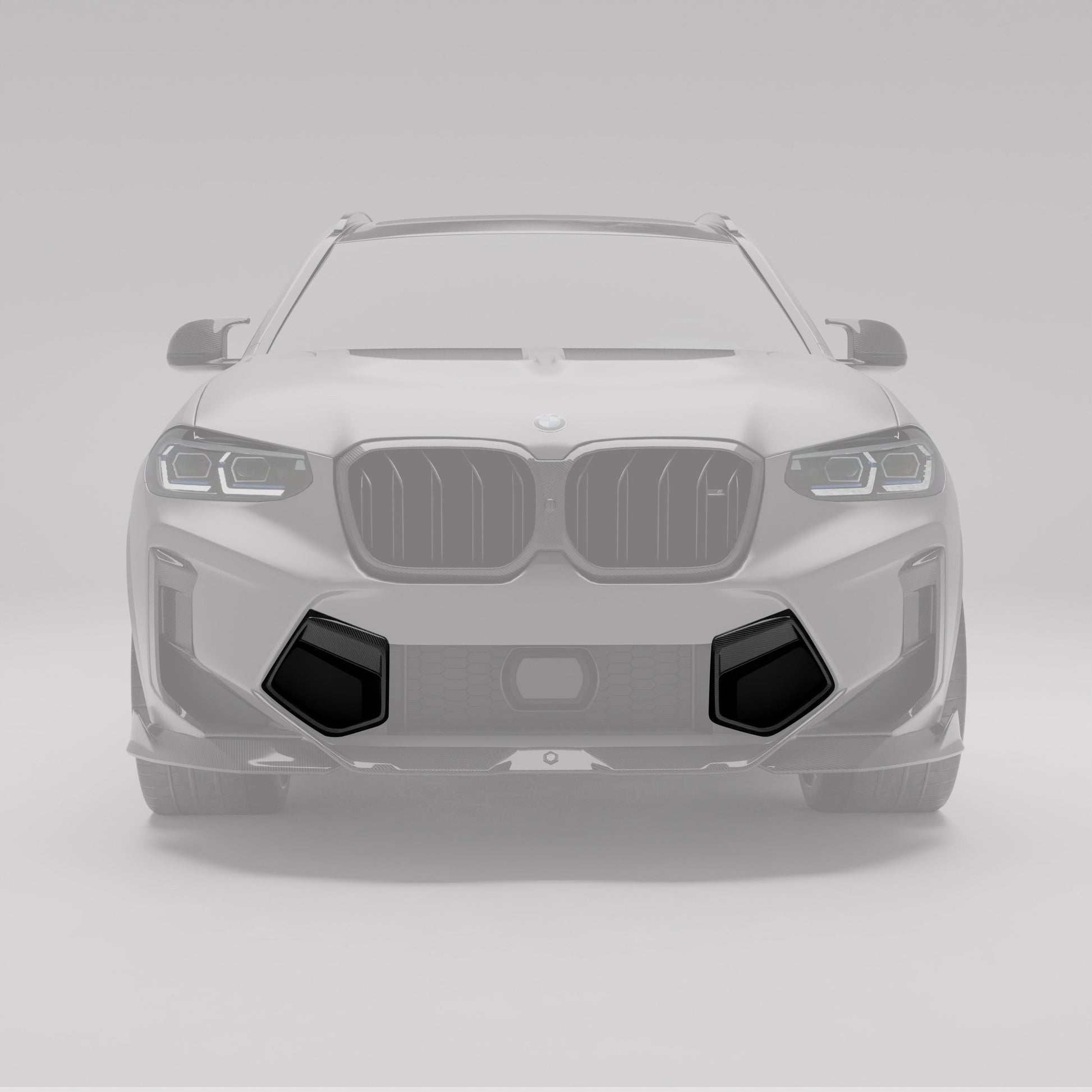 BMW X3M F97 LCI carbon bumper vents highlighted on the lower fascia