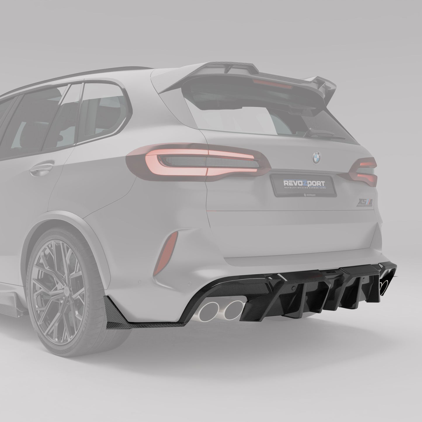 BMW X5M F95 carbon fiber rear diffuser fitted, angled detail view