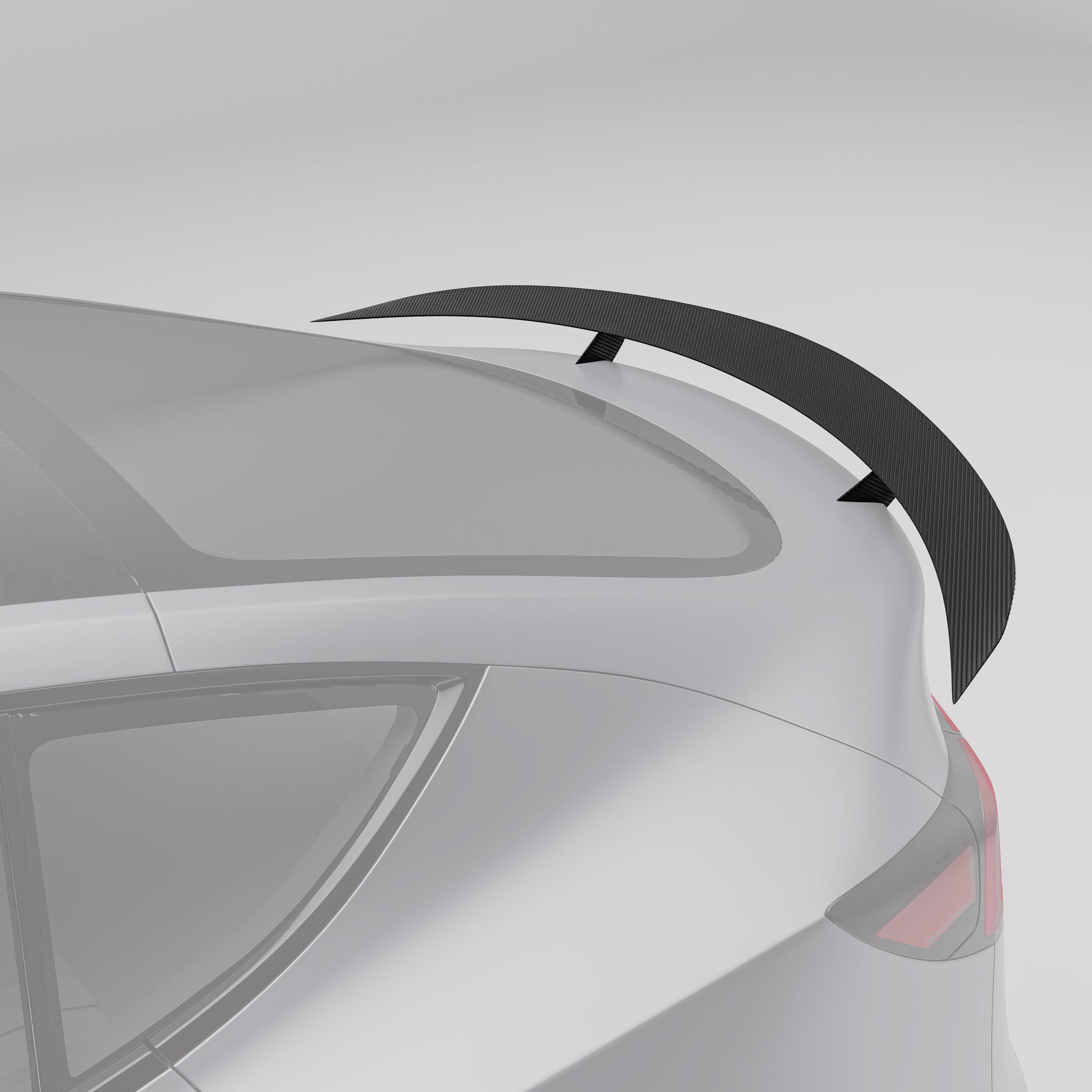 Carbon fiber rear spoiler shown at an angle on Model Y