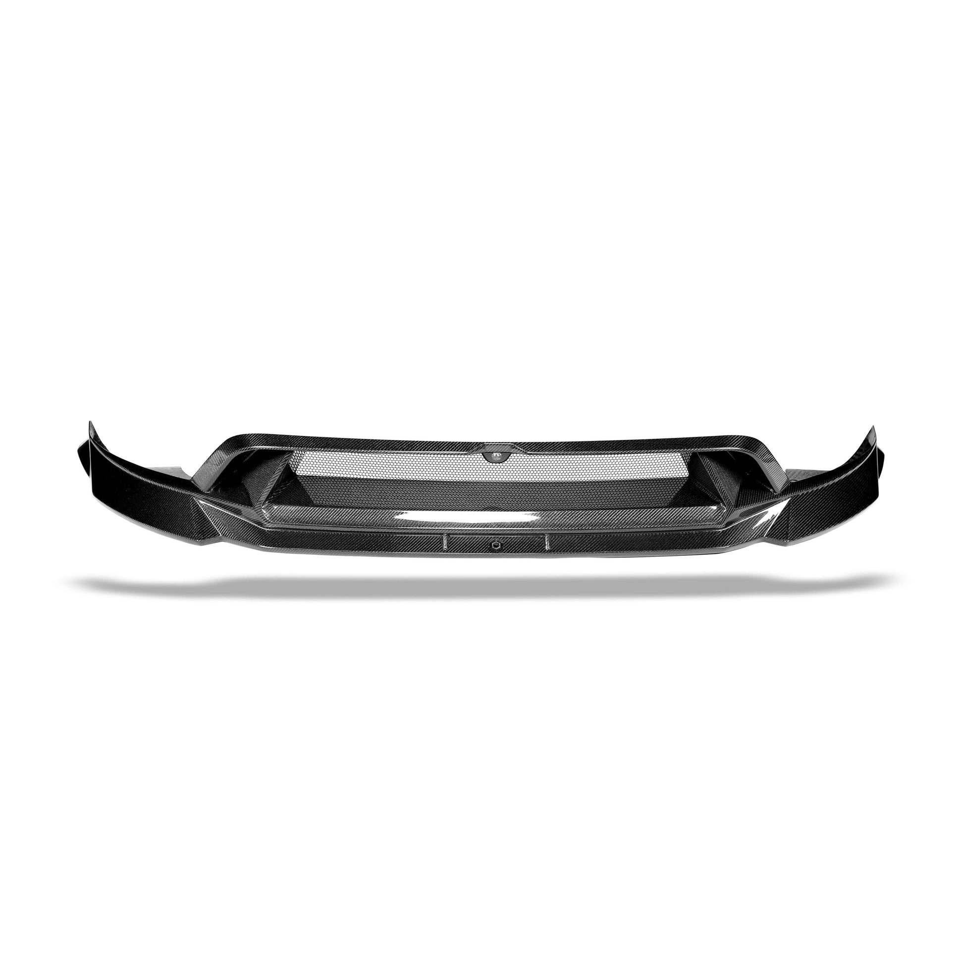 Carbon fiber front lip detail extending below the Model Y bumper