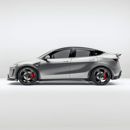 Tesla Model Y facelift carbon fiber wheel arch trims, front three-quarter view on the car