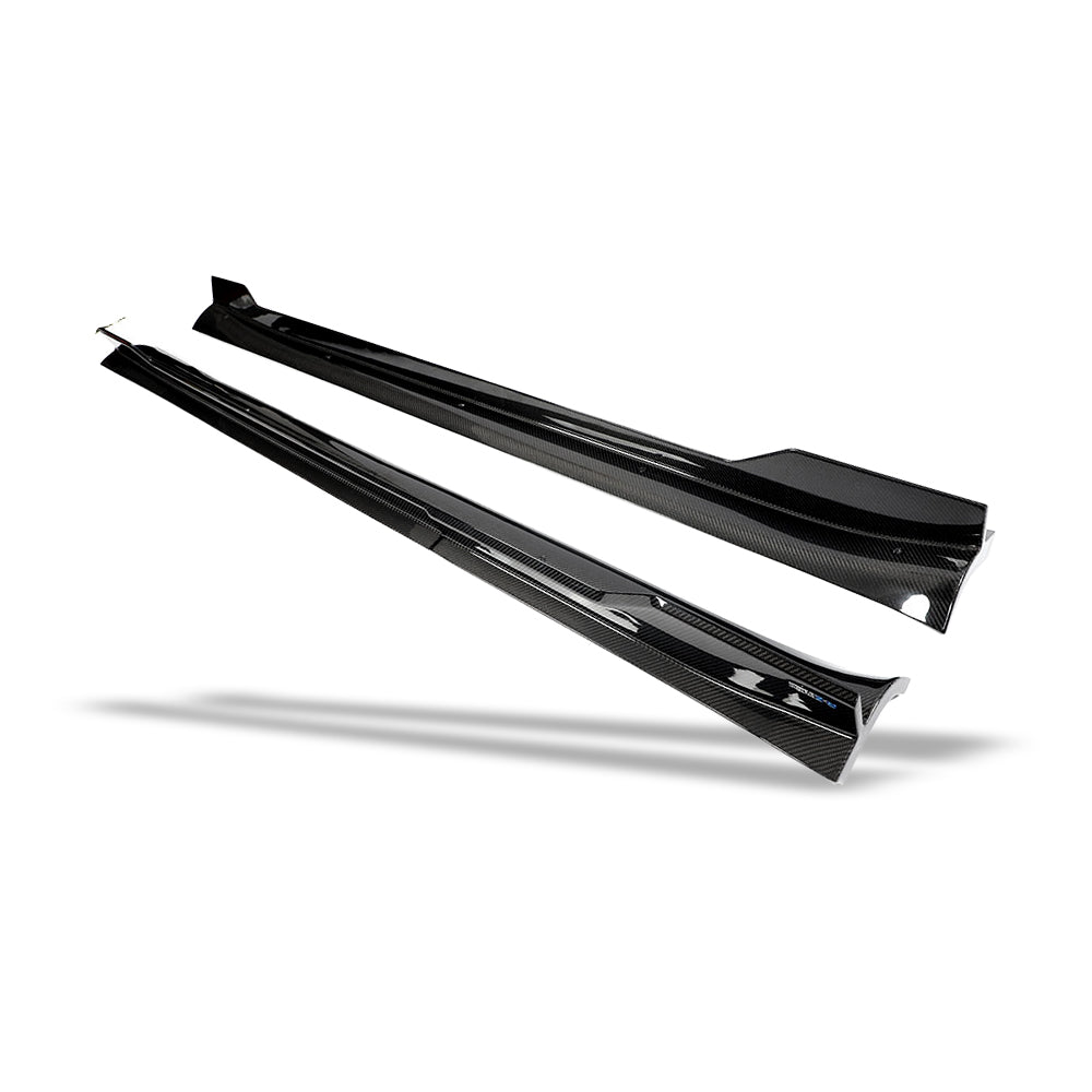 Carbon fiber side skirt mounted along the rocker profile angle
