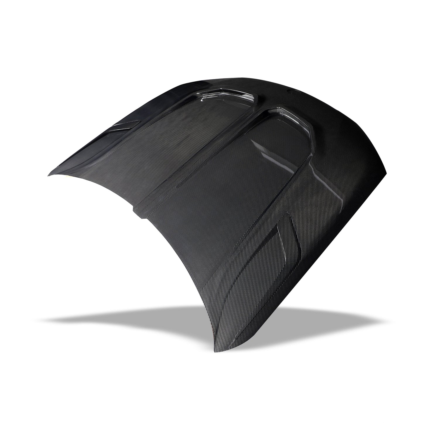 Angled view of the X6M F96 carbon fiber hood styling